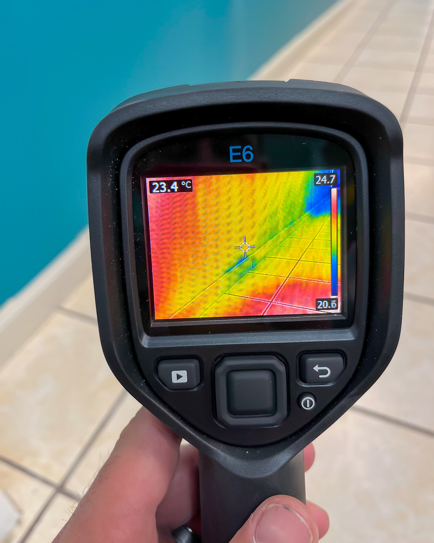 Thermal imaging scan of water damaged tile floor near pool