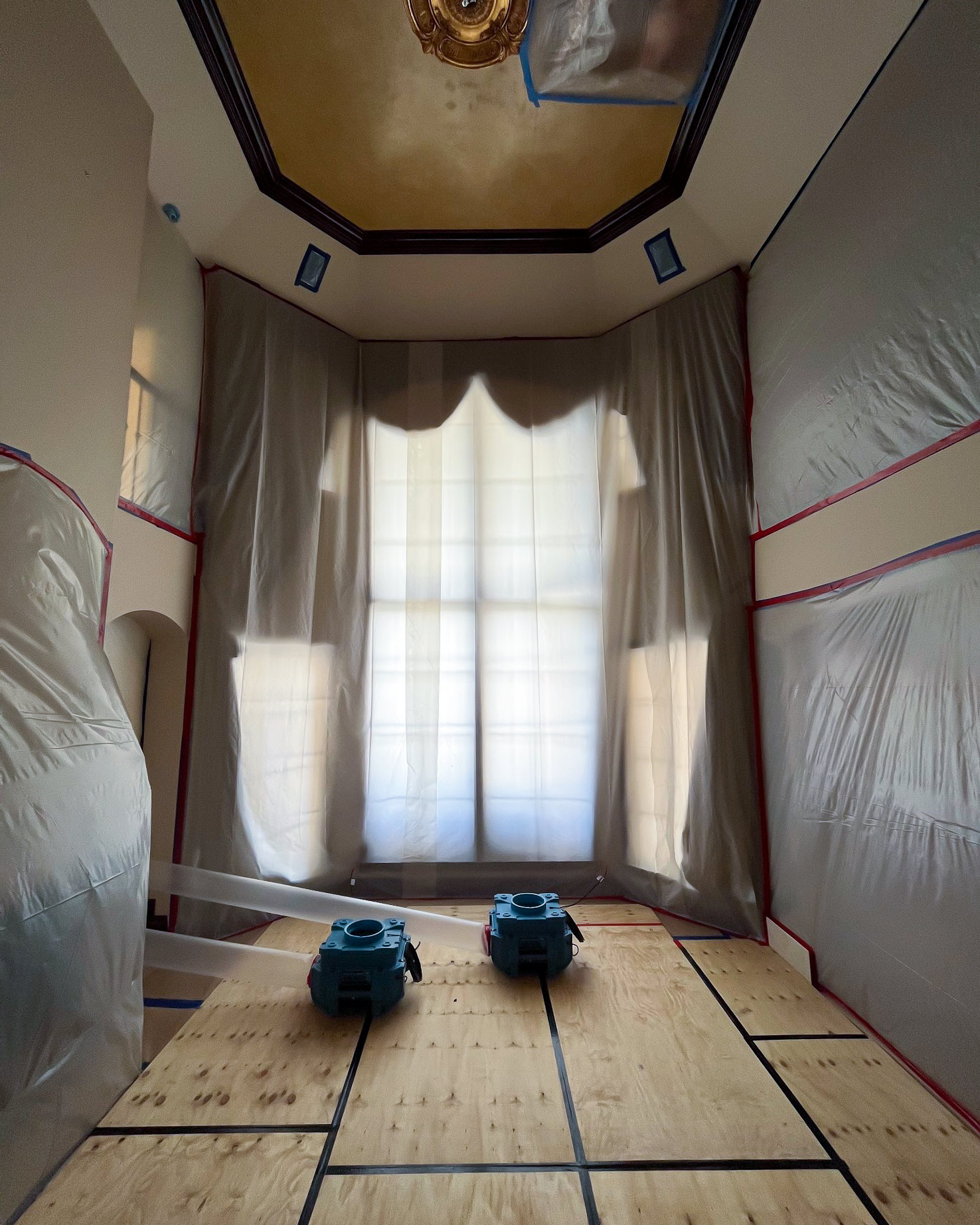 Room fully sealed with plastic sheeting and air movers