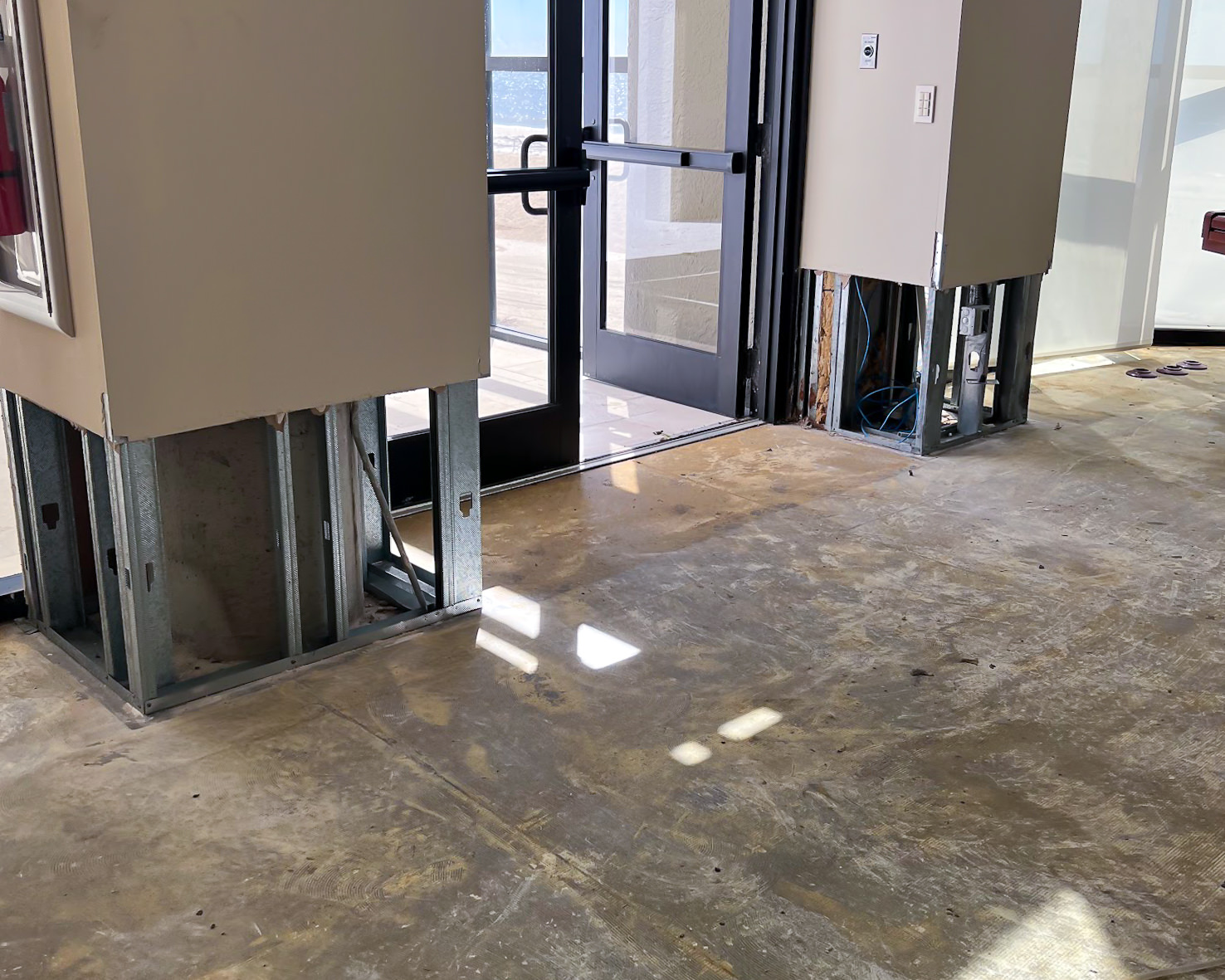 Commercial building restoration — drywall removed and structural work underway